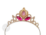 Gold tiara with pink gemstones on a white background princess aurora crown